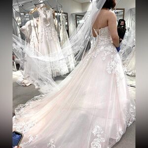 White wedding dress, size medium. Never worn after this picture